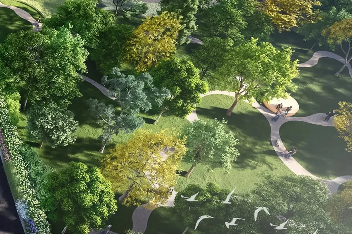緑豊かな公園の空撮。曲がりくねった散歩道があり、人々がくつろいでいる