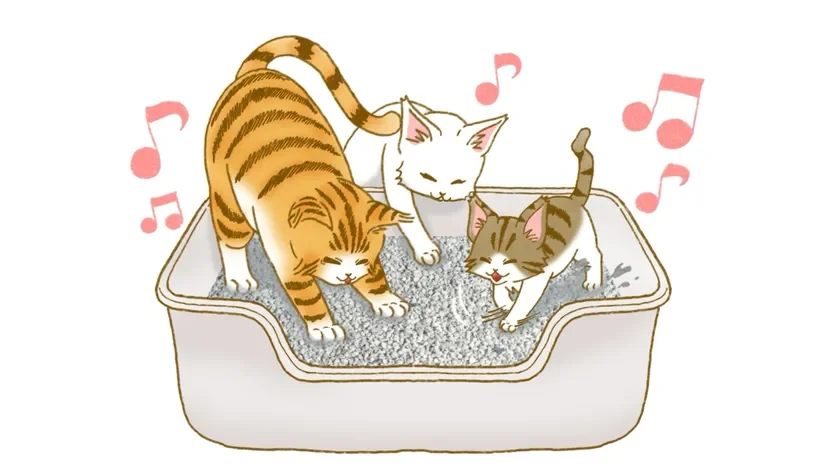 猫用トイレの中で、3匹の子猫たちが楽しそうに砂を掘ったり遊んだりしているイラスト。音符が描かれ、賑やかで可愛らしい雰囲気が伝わります。